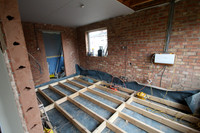 New joists with dpc to raise floor to match existing house floor