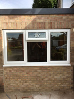 Garage door removed and bricked up. New window fitted