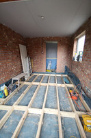 New joists with dpc to raise floor to match existing house floor